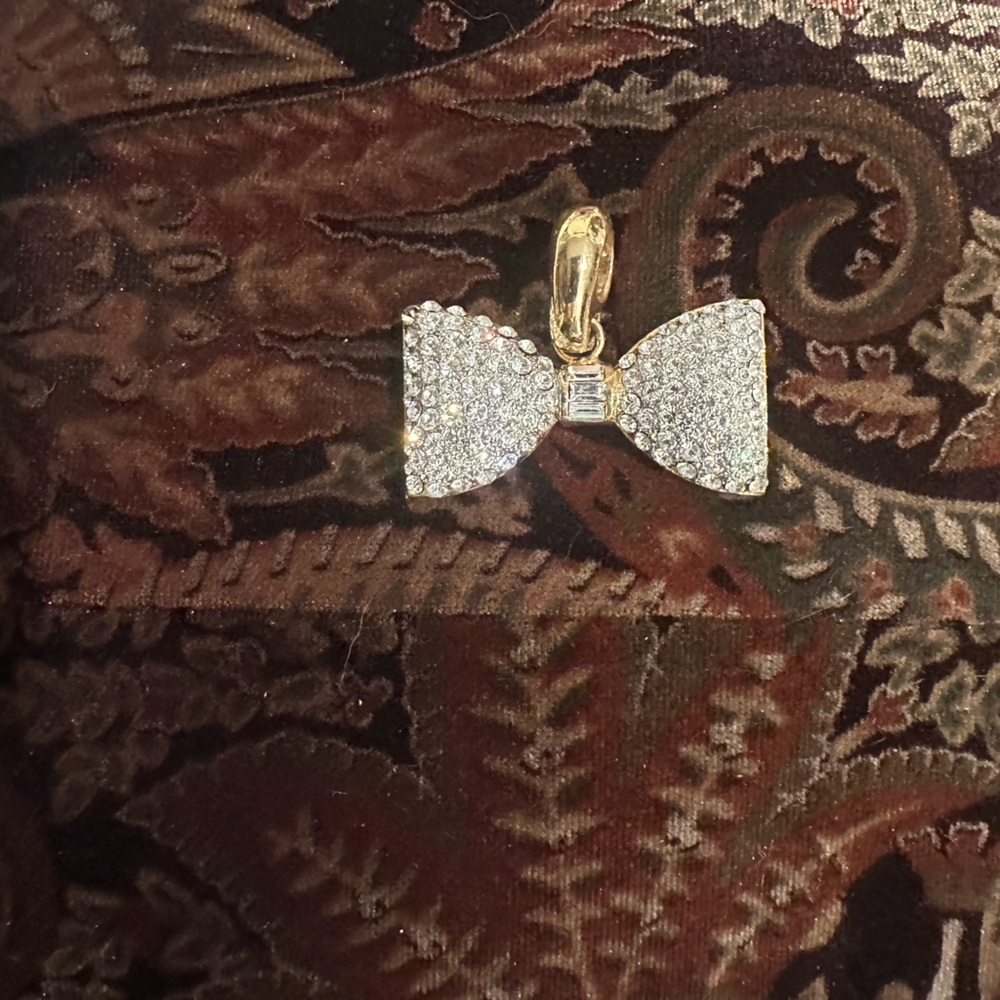 Elegant Gold and Silver Bow Pendant